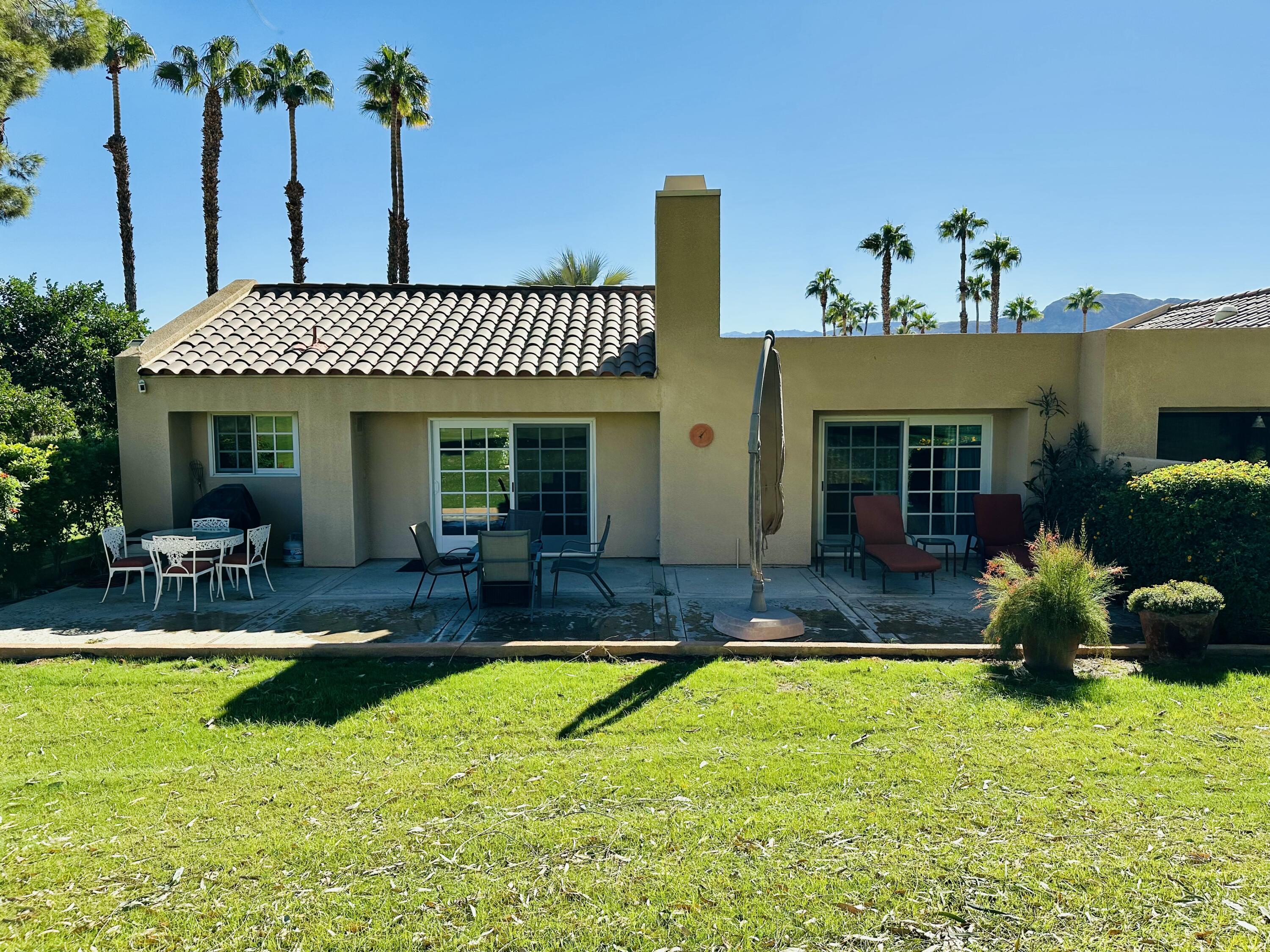 a view of a house with swimming pool yard and porch