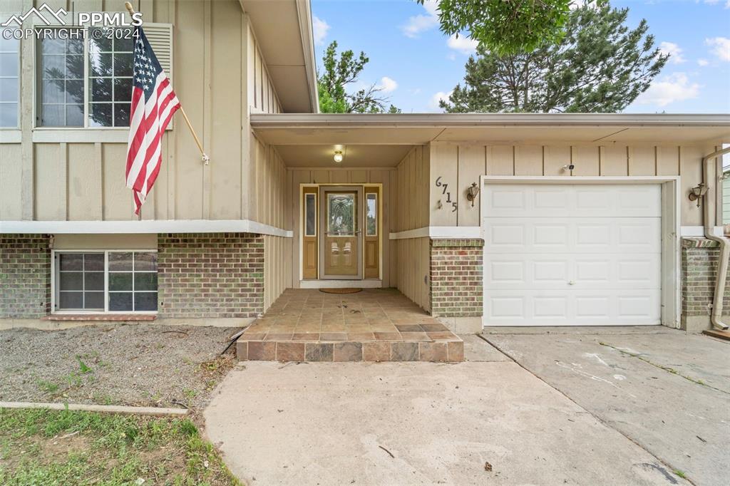 Entrance to property with a garage