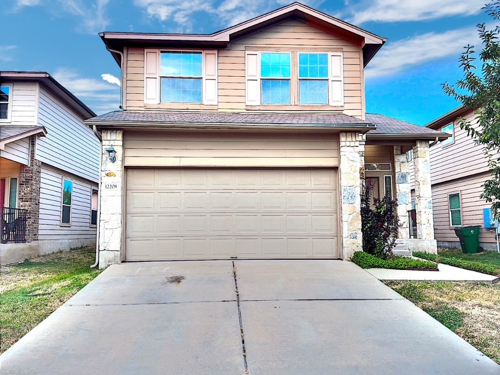 a front view of a house with a garage