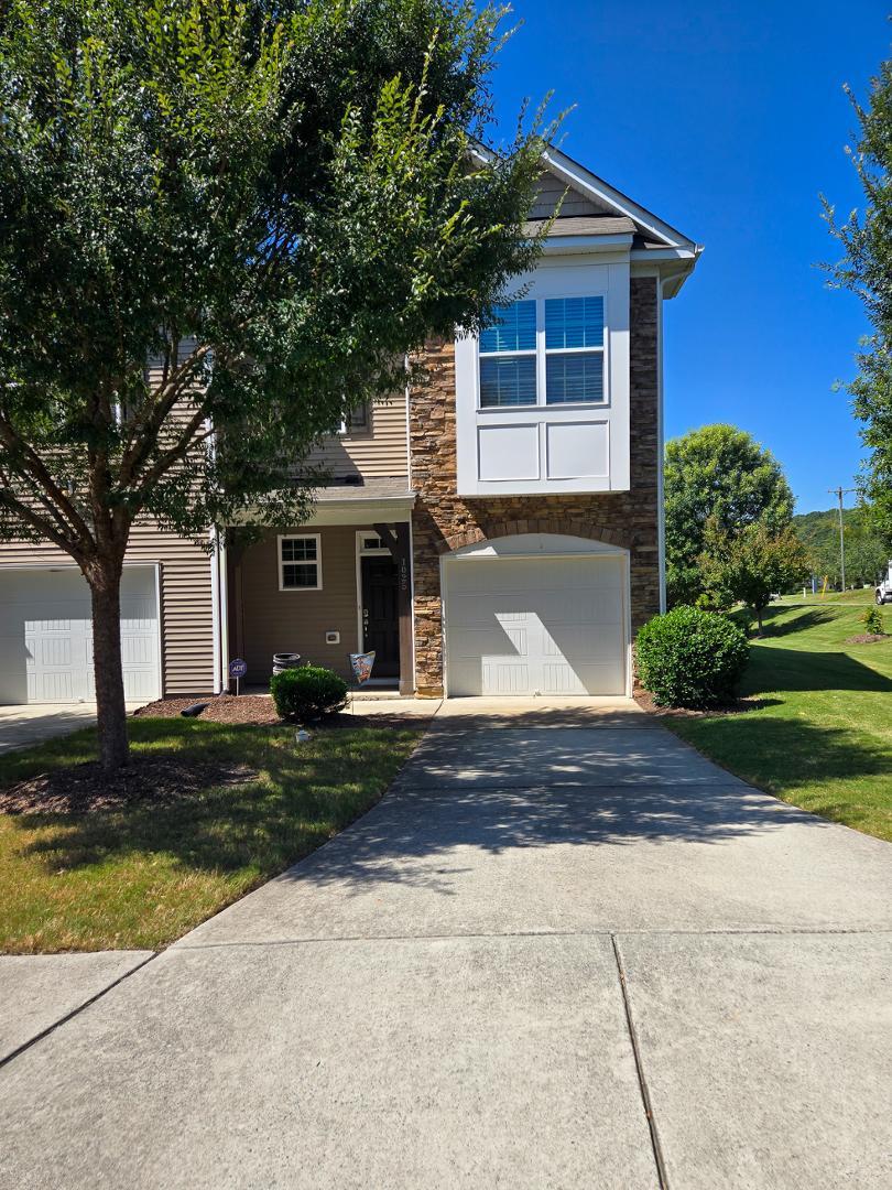 front view of a house and a yard