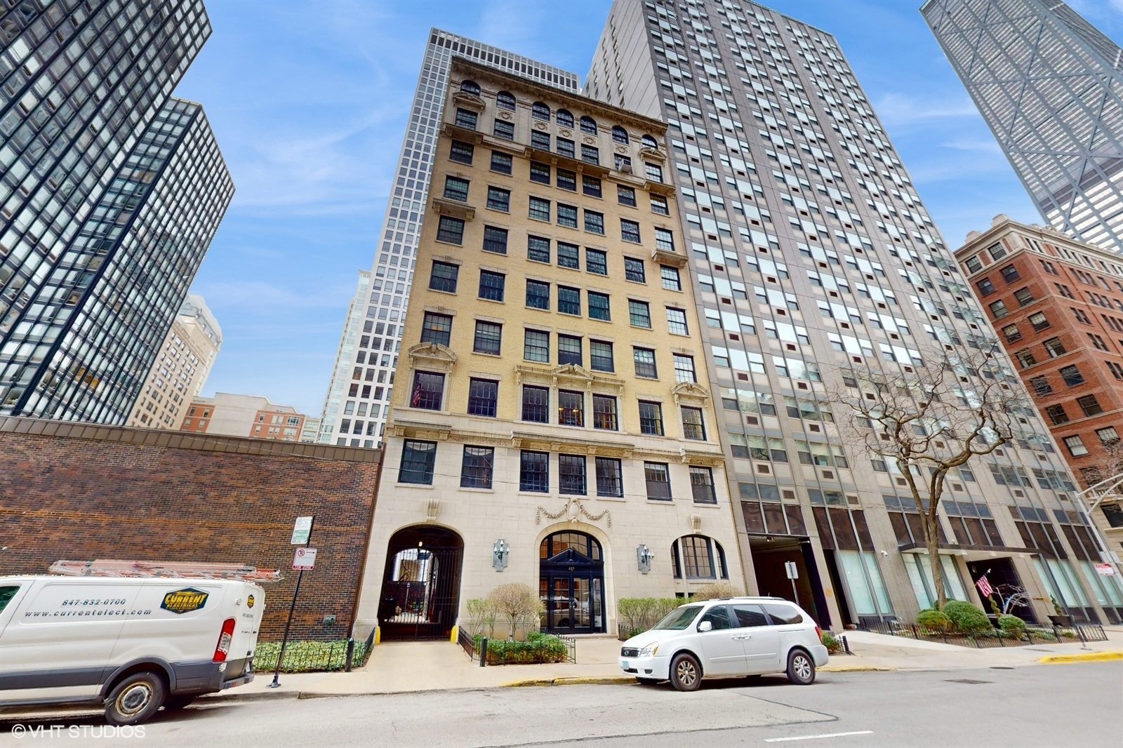 a front view of a building with parking space