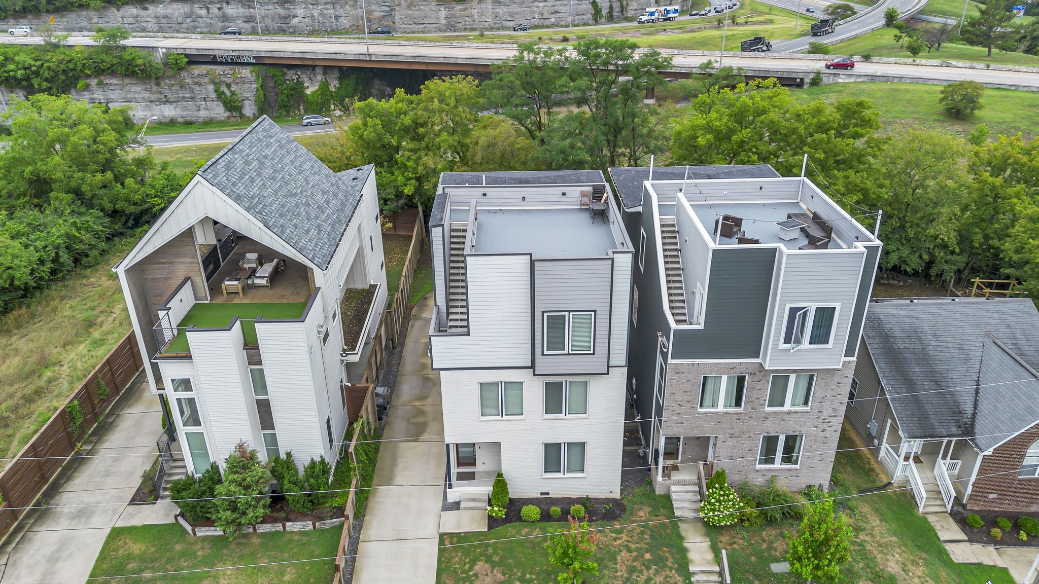 a aerial view of a house with a yard and plants