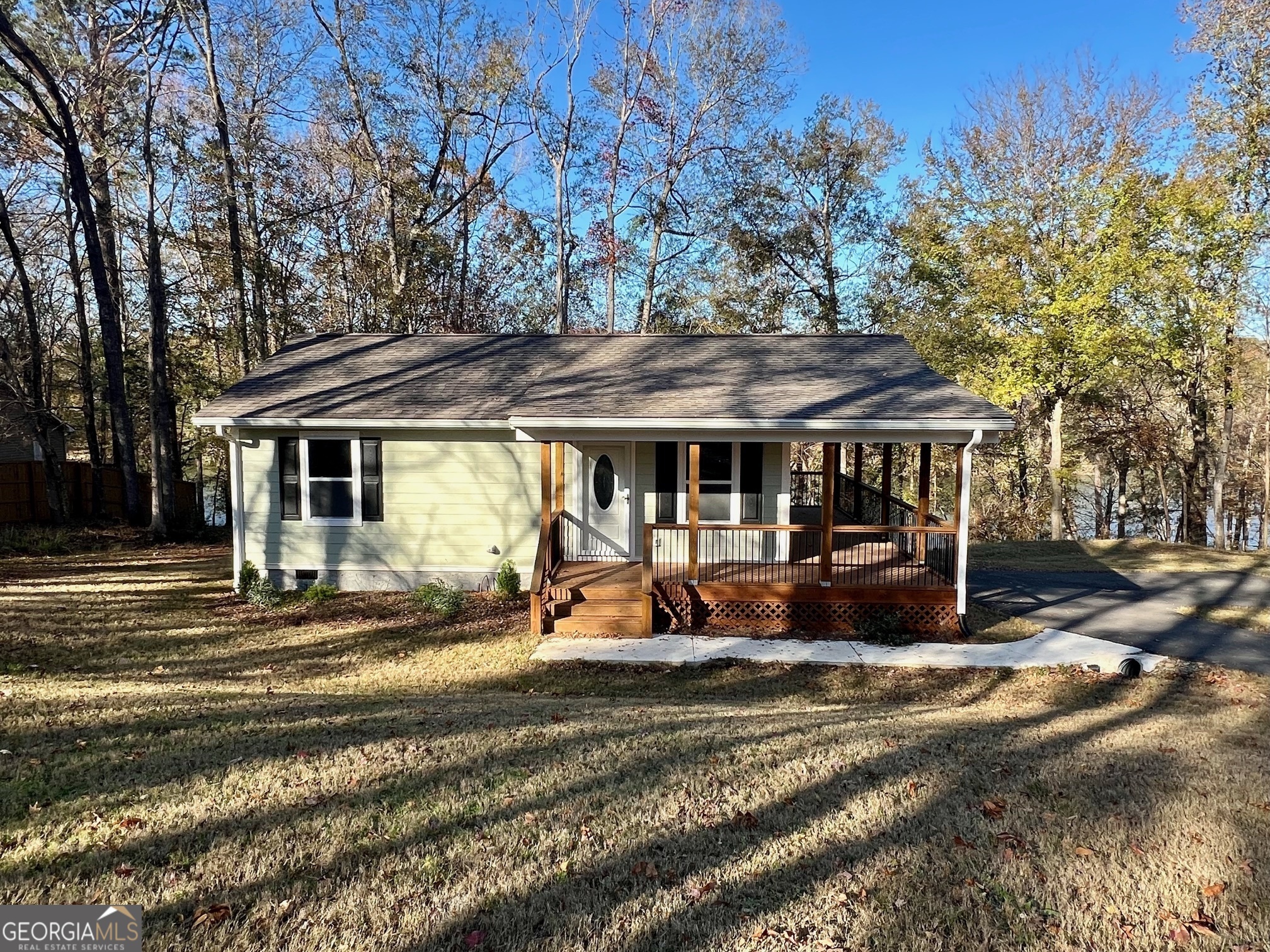 a view of a house with backyard porch and sitting area