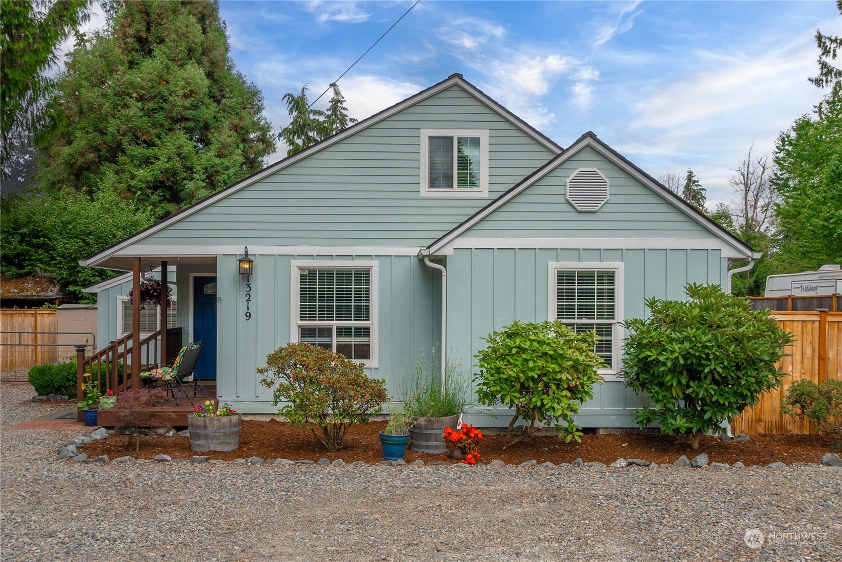 a front view of a house with garden