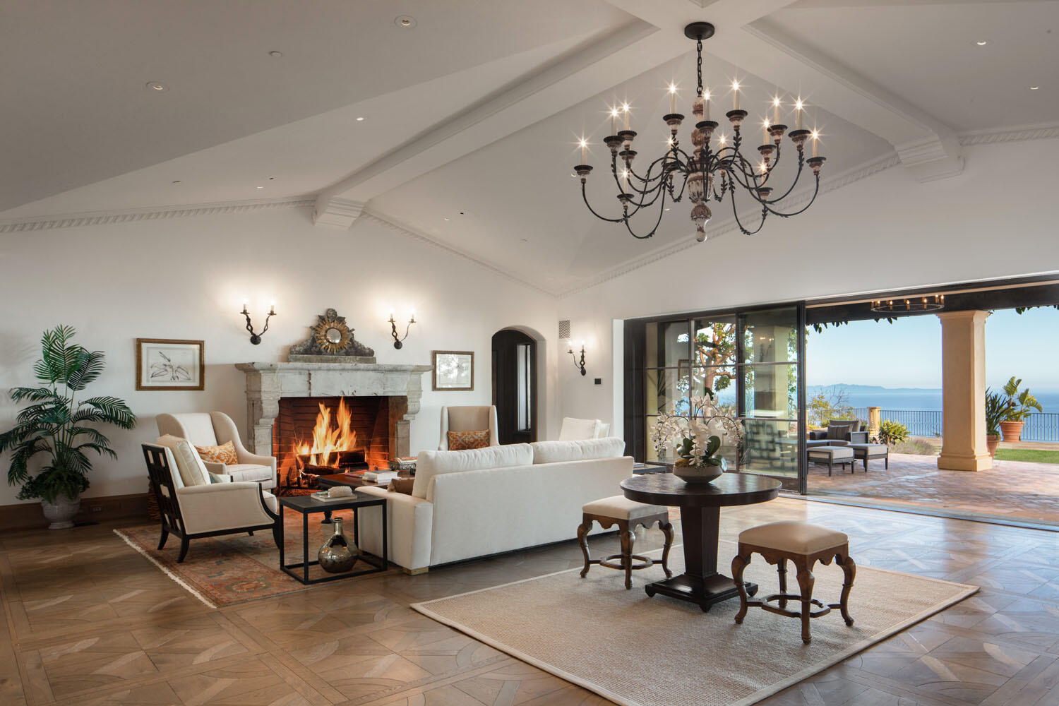 a view of a dining room with furniture wooden floor and chandelier