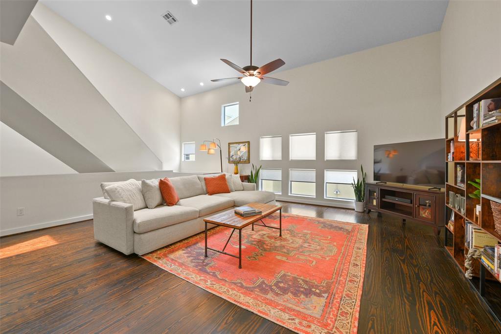 a living room with fireplace furniture and a flat screen tv