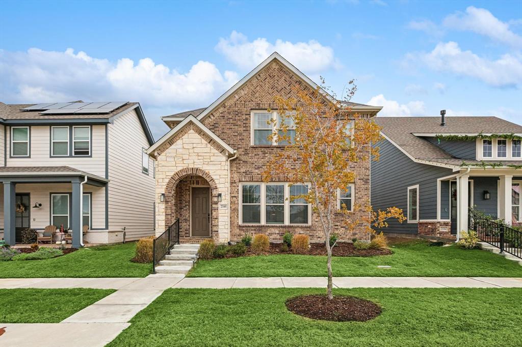 a front view of a house with a yard