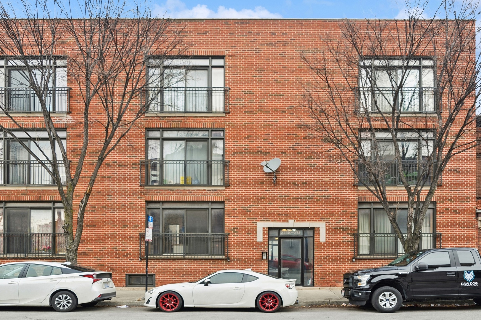 front view of a house with car parked