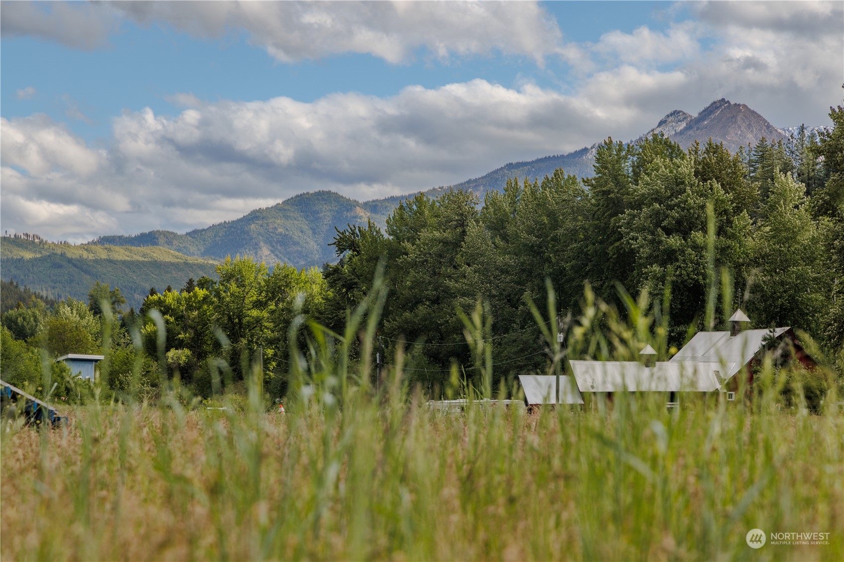 a view of a lake with a house in the background