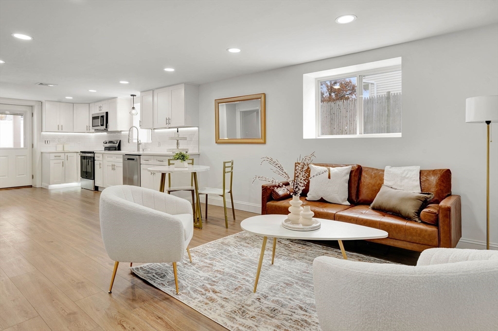 a living room with furniture and a table