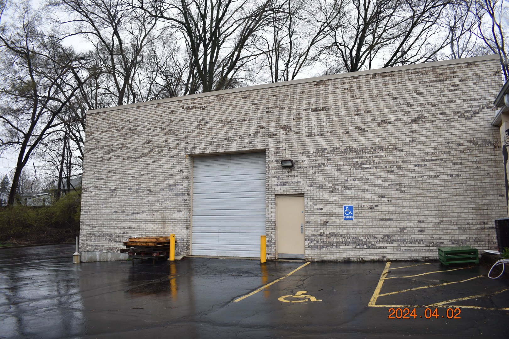 a brick building with a bench in front of it