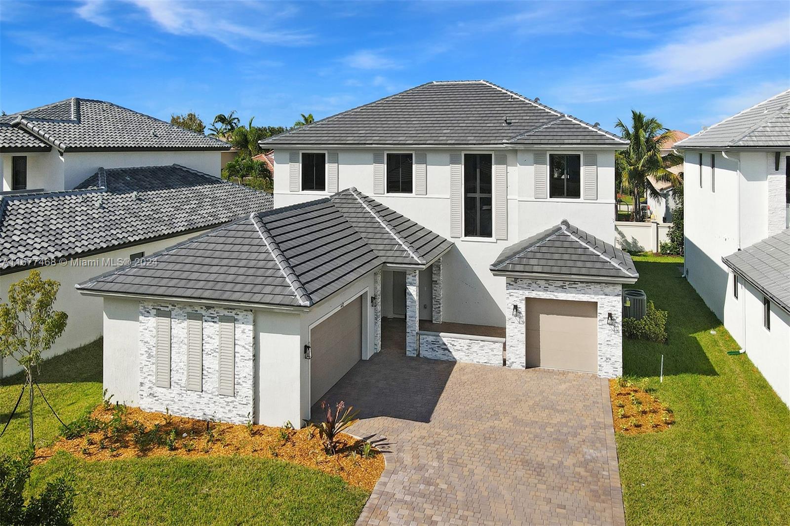 a front view of a house with a yard