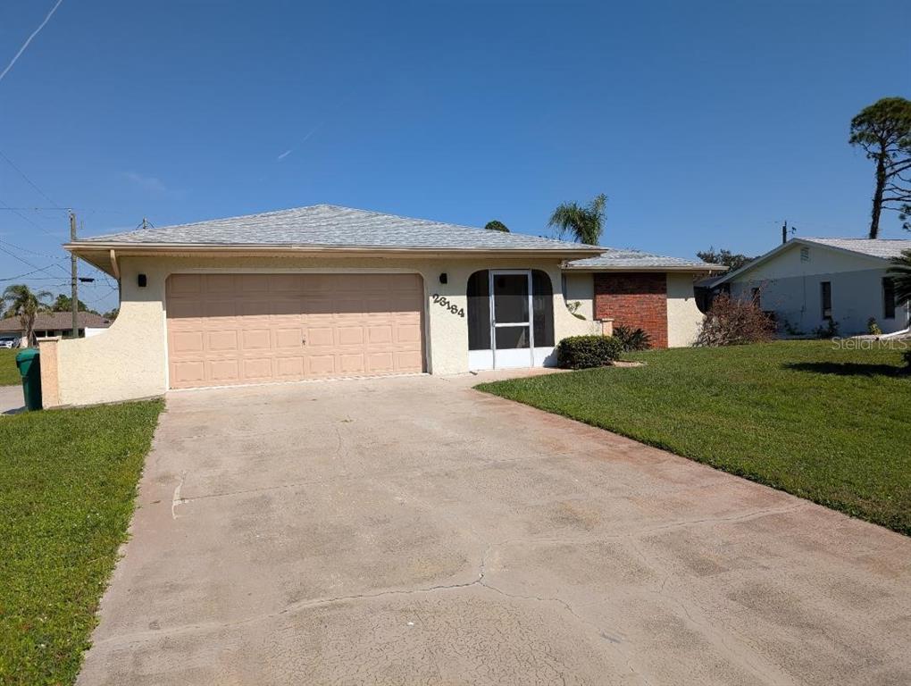 a view of a house with a yard