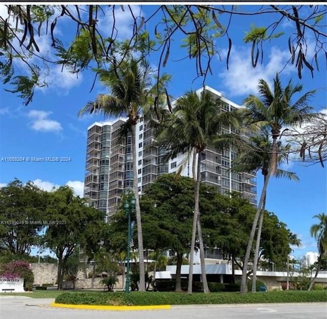 a view of a palm trees in front of a building