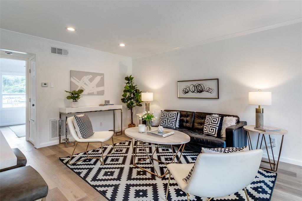 a living room with furniture and a table