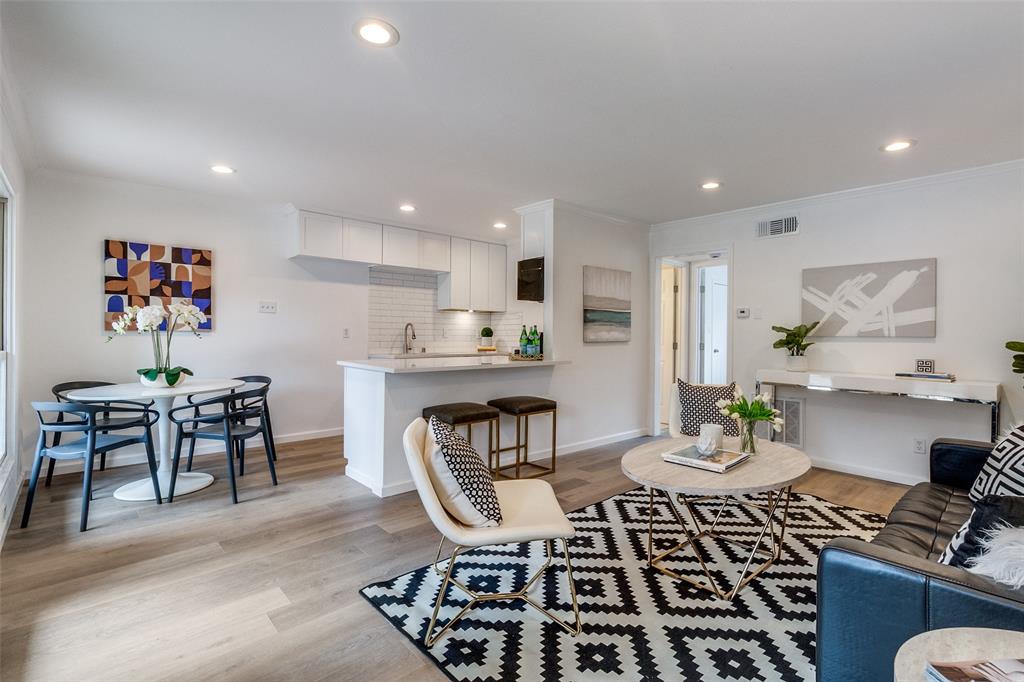 a kitchen with a dining table and chairs