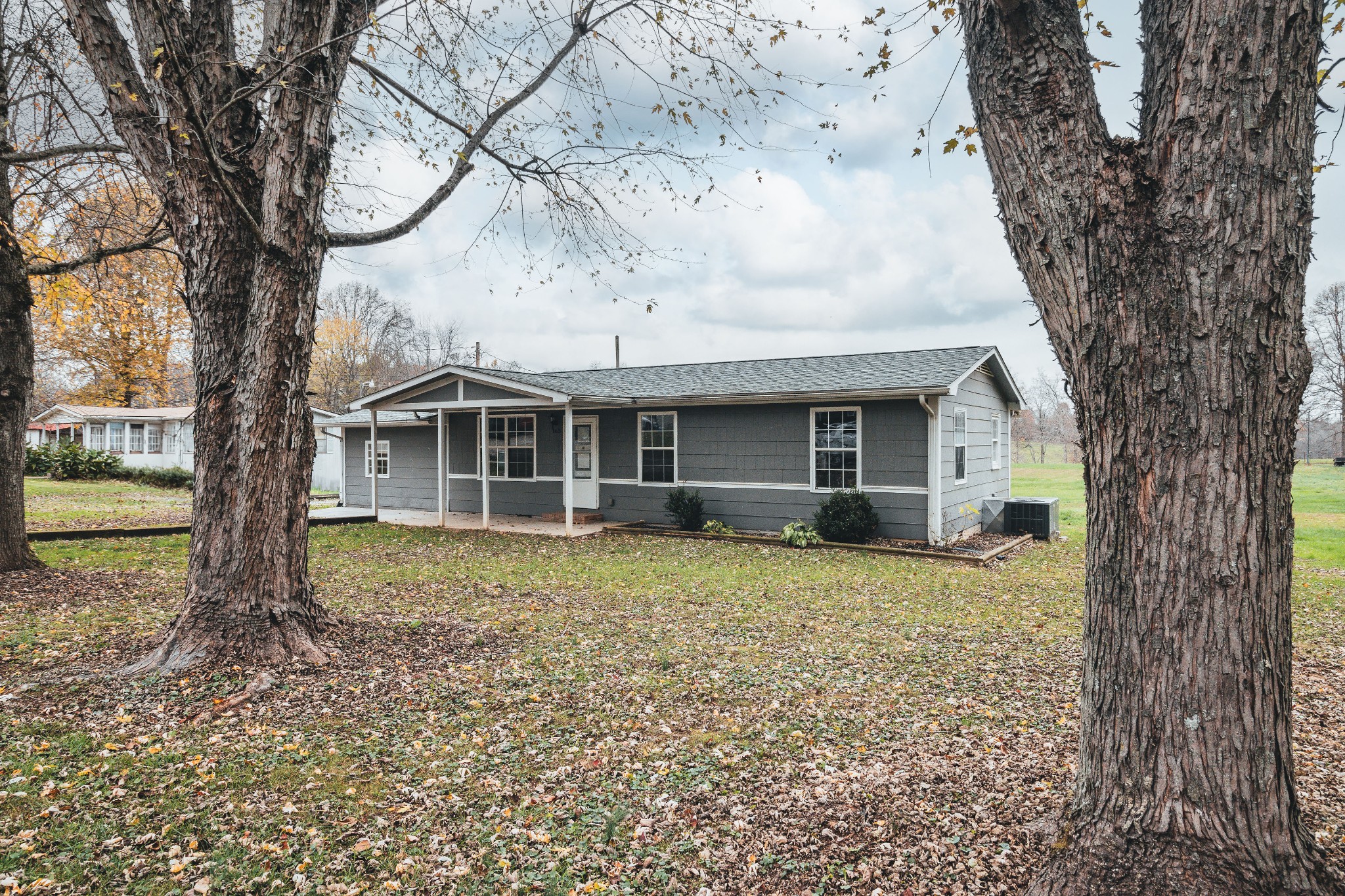 a house with trees in front of it