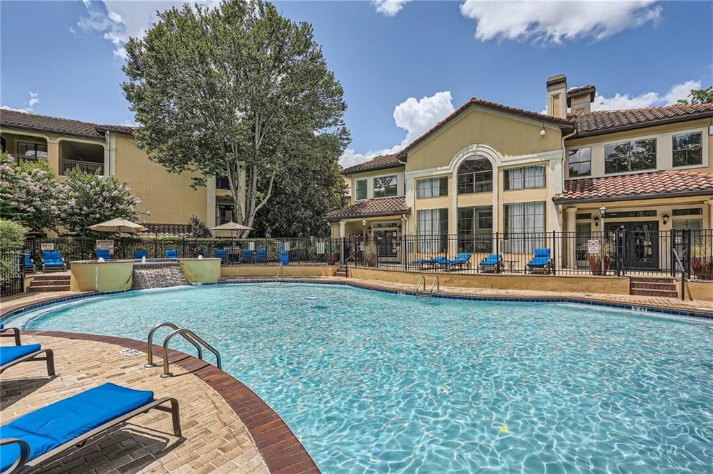 a view of a house with swimming pool