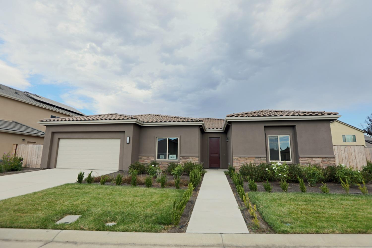 Fantastic curb appeal, with tile roofing, decorative stucco stone and full front yard landscaping!