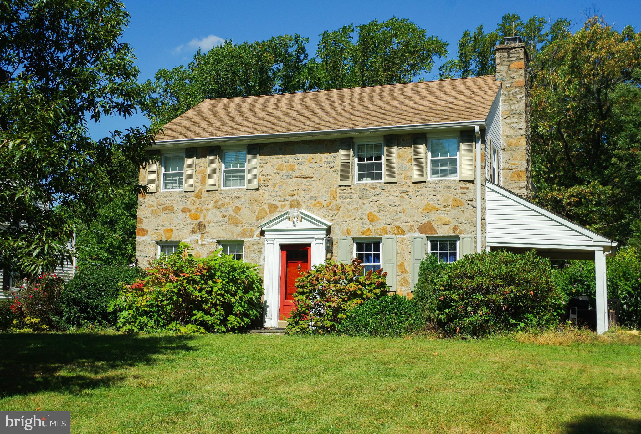 a aerial view of a house next to a yard