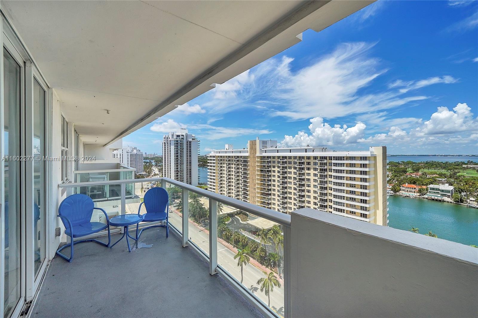 a view of a chairs and table in a balcony