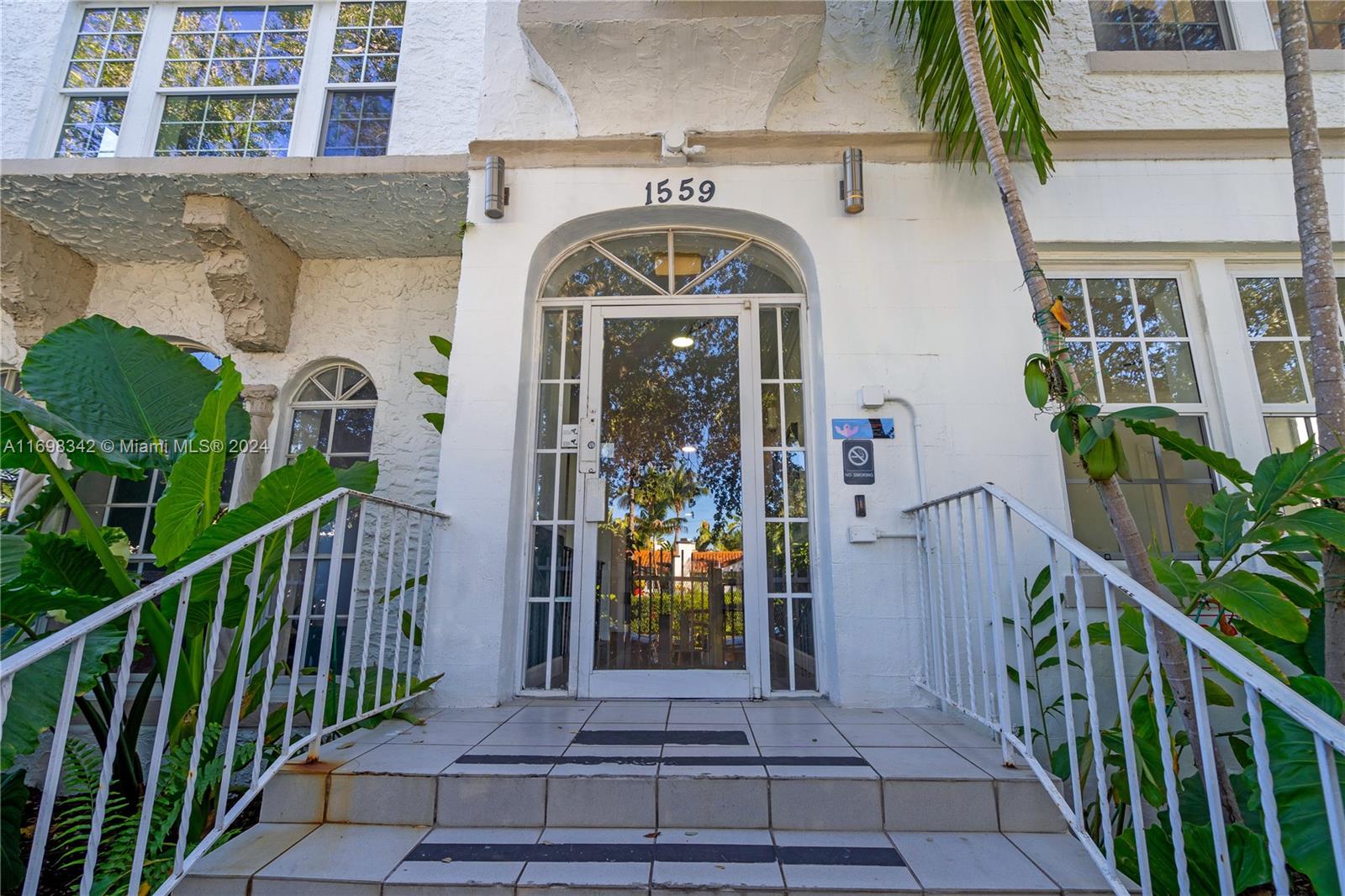 a view of a door of the house with a porch