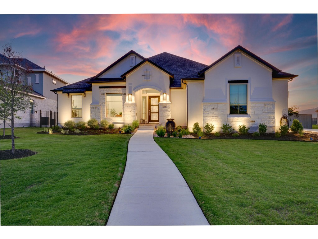 a front view of a house with a yard