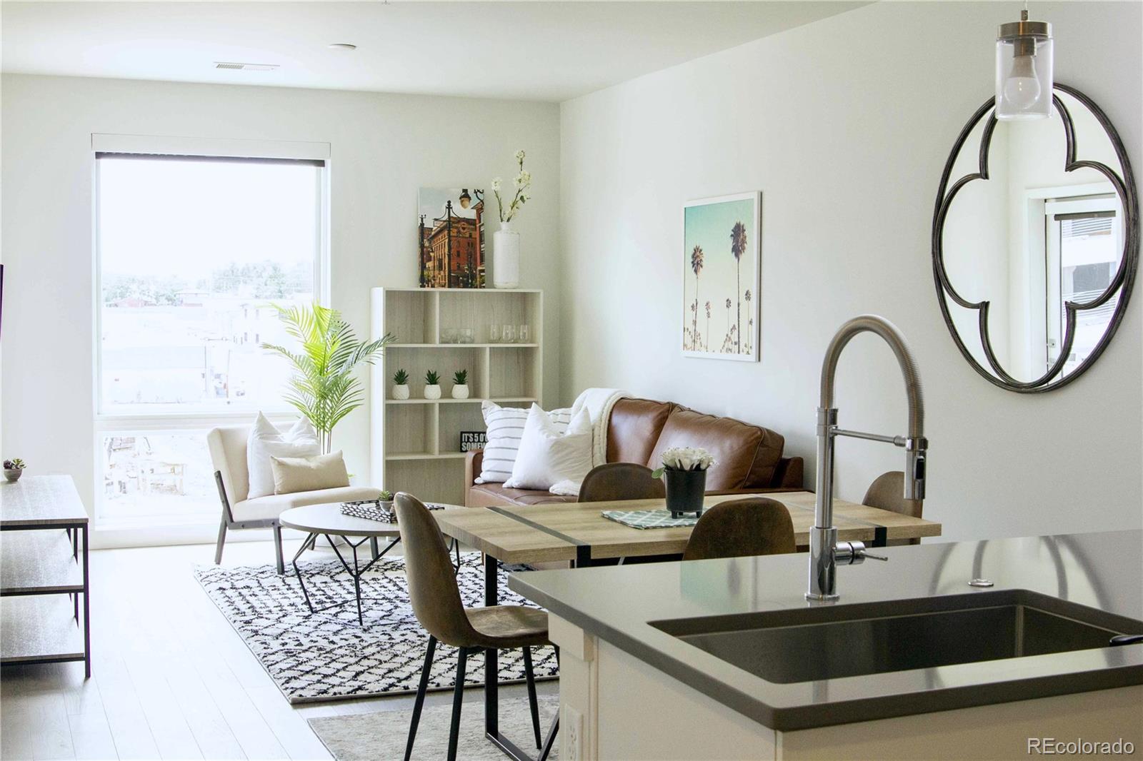 a kitchen with a table and chairs