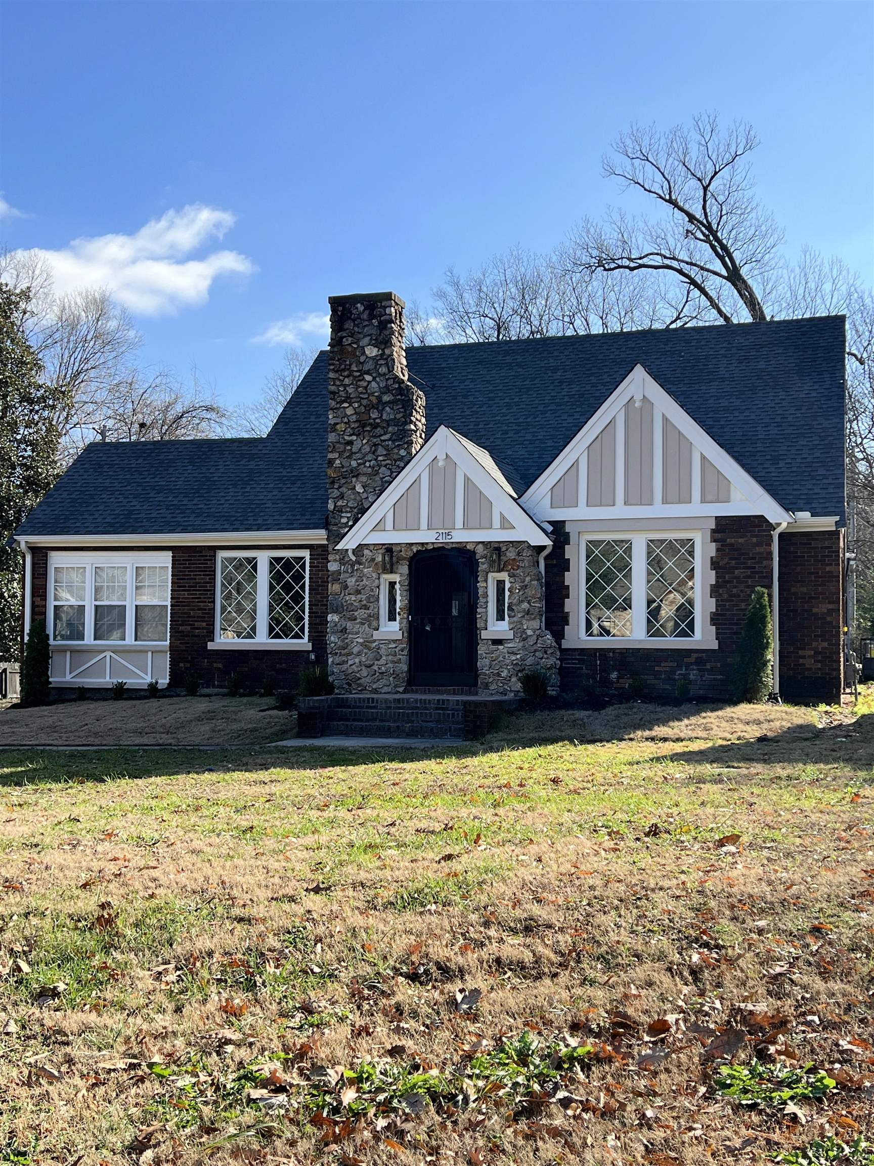 View of front of property with a front lawn