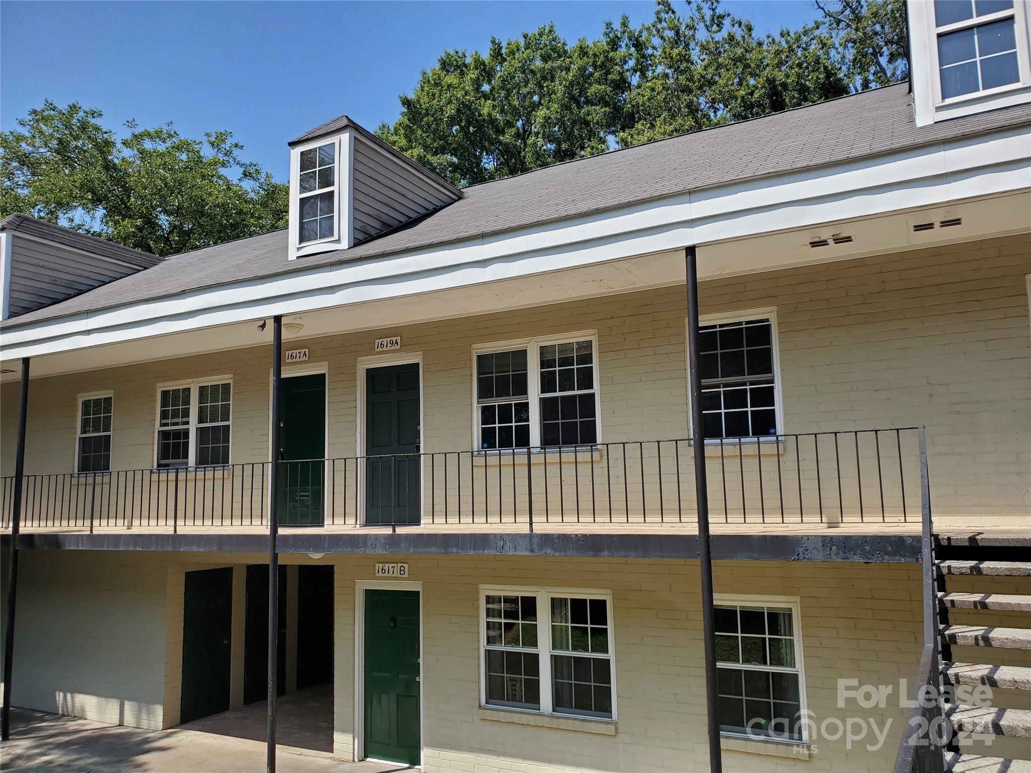 a view of a house with a window and balcony