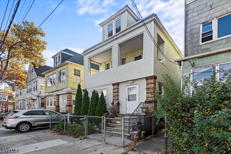 a front view of a house with parking