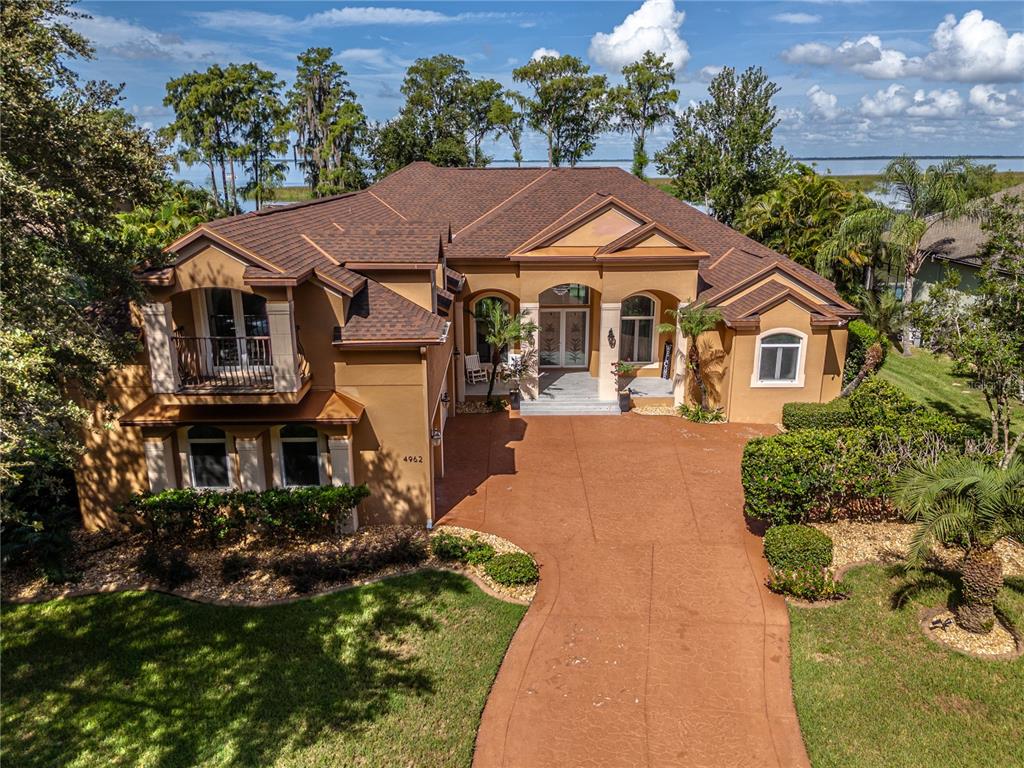 a aerial view of a house with a yard