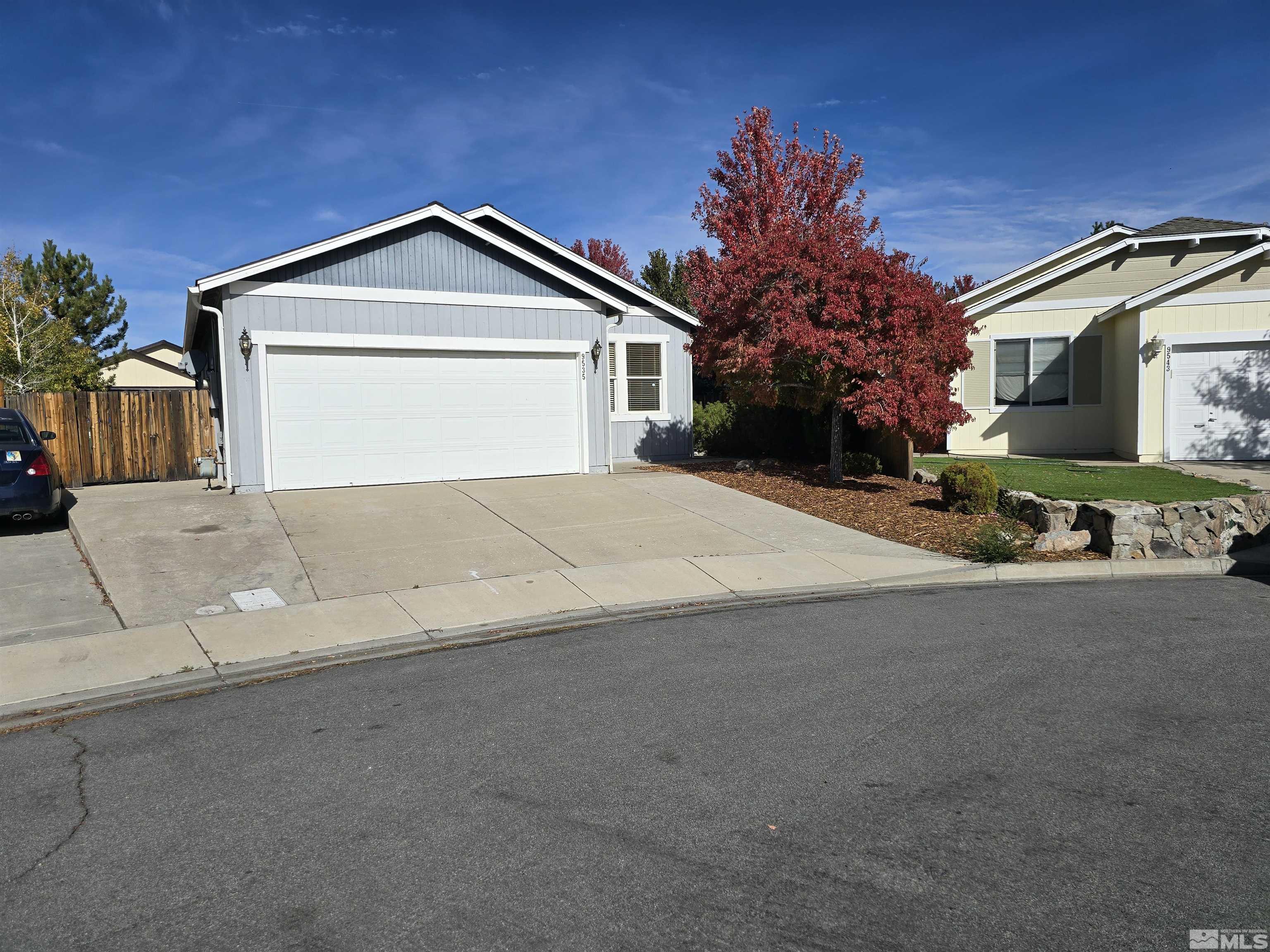 a view of garage and yard