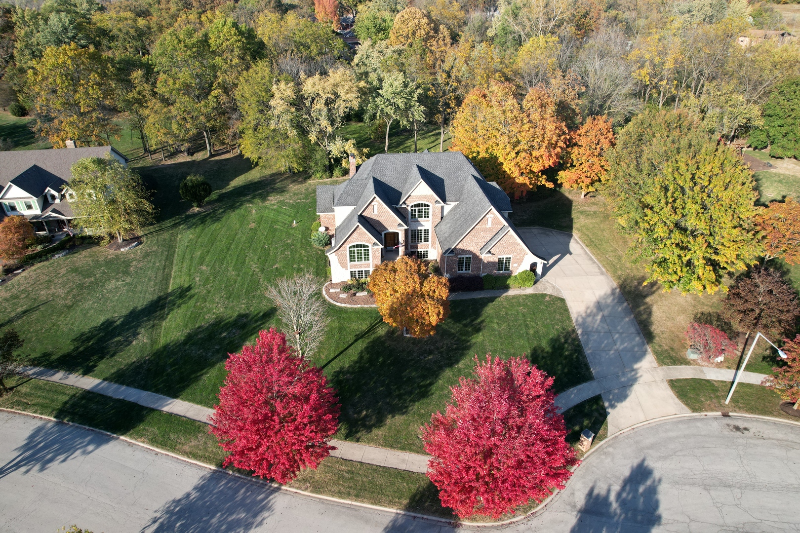 an aerial view of a house with outdoor space