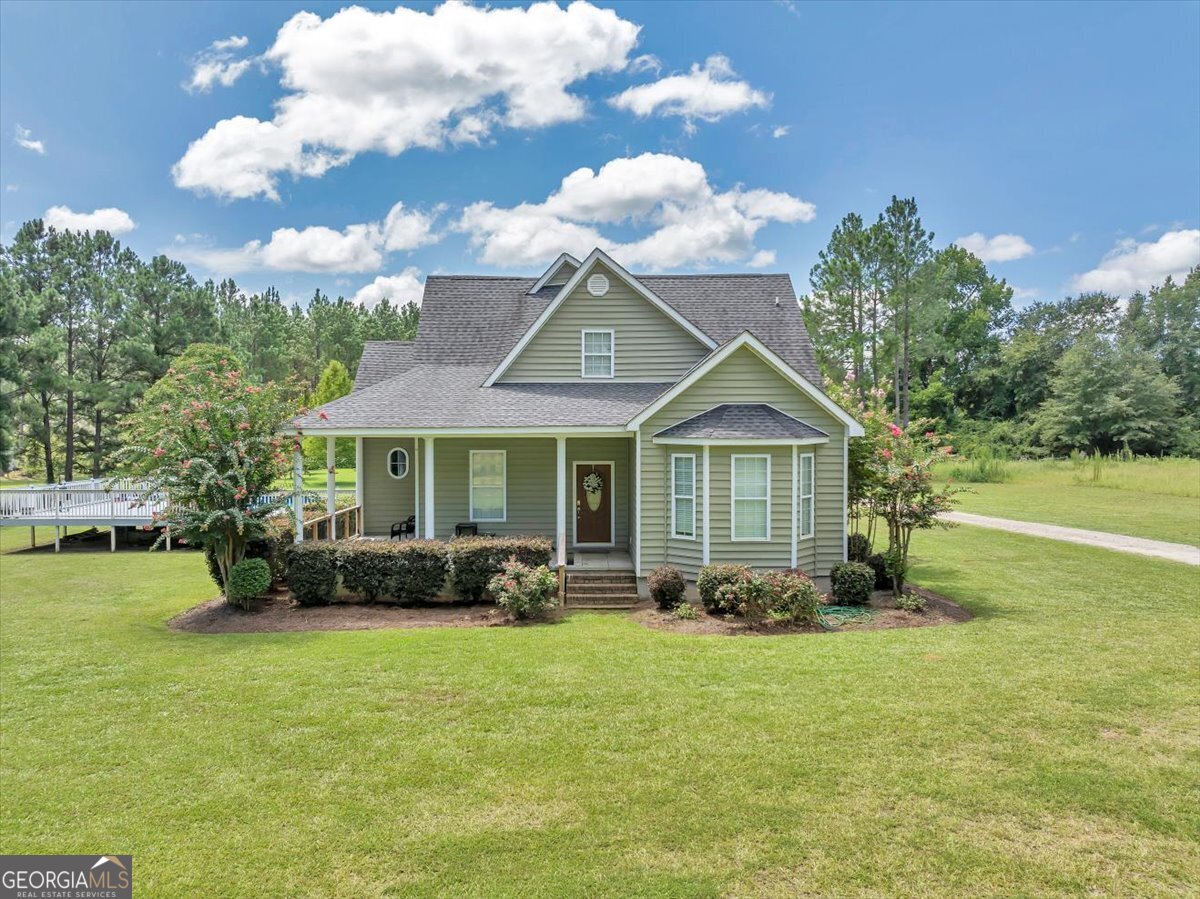 a front view of a house with garden