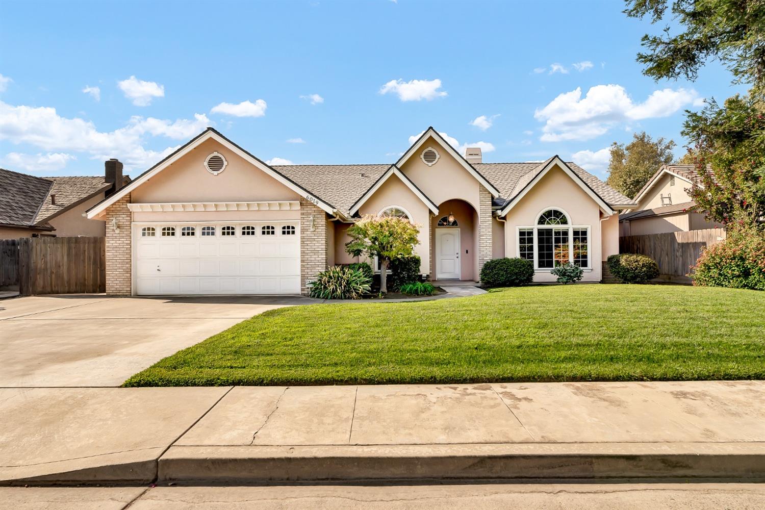 a view of front of house with a yard