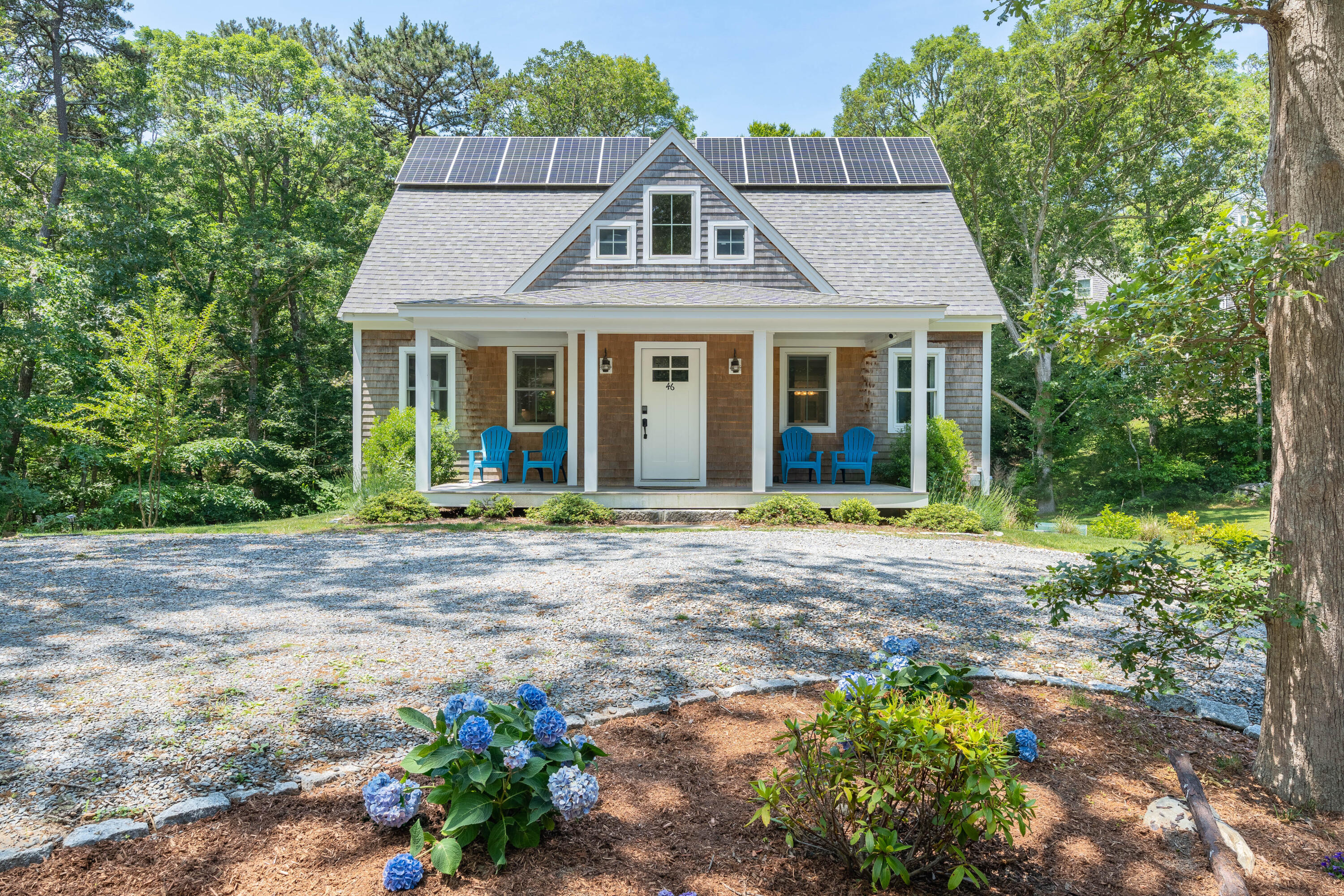 front view of a house with a yard