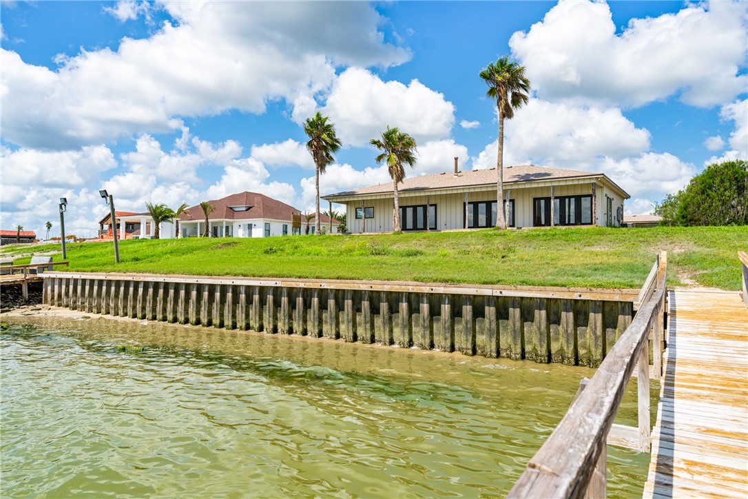 a view of a house with a wooden deck