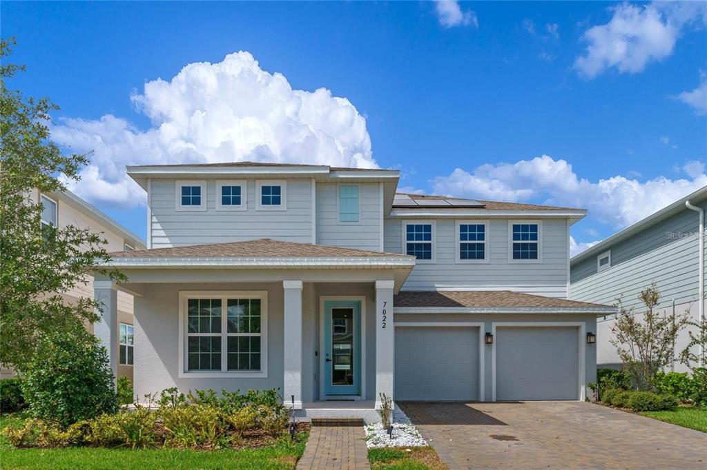 front view of a house with a yard