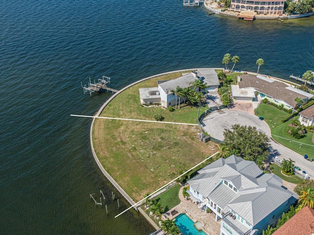 an aerial view of a house with a ocean view