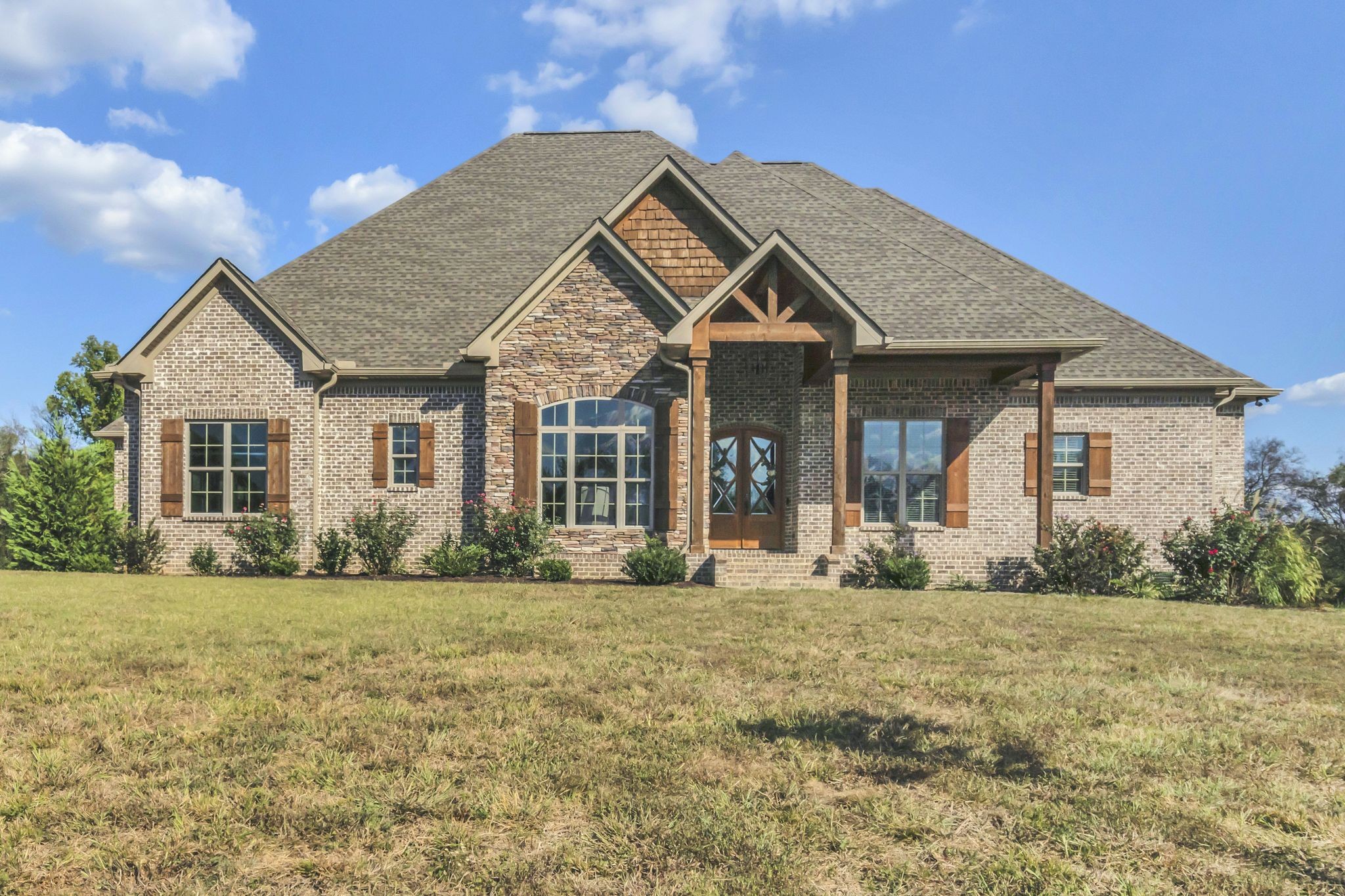 a front view of a house with a yard