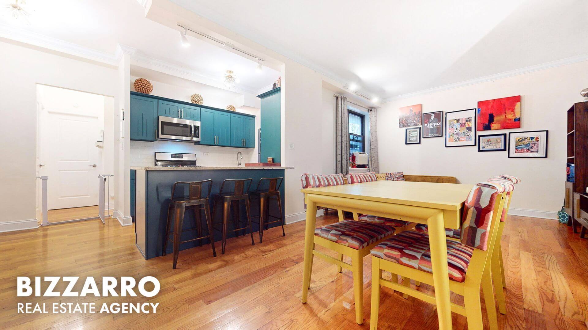 a view of kitchen with stainless steel appliances cabinets and wooden floor