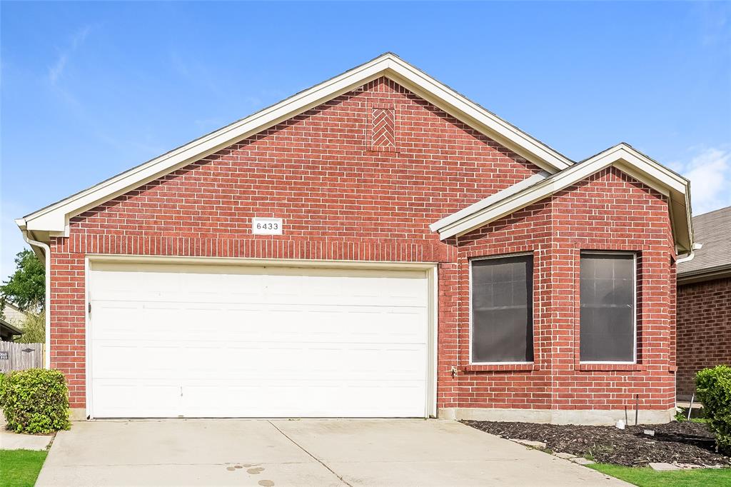 a view of a house with garage