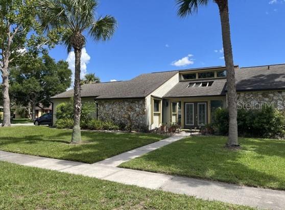 The home sits on a huge corner lot with a side facing garage.