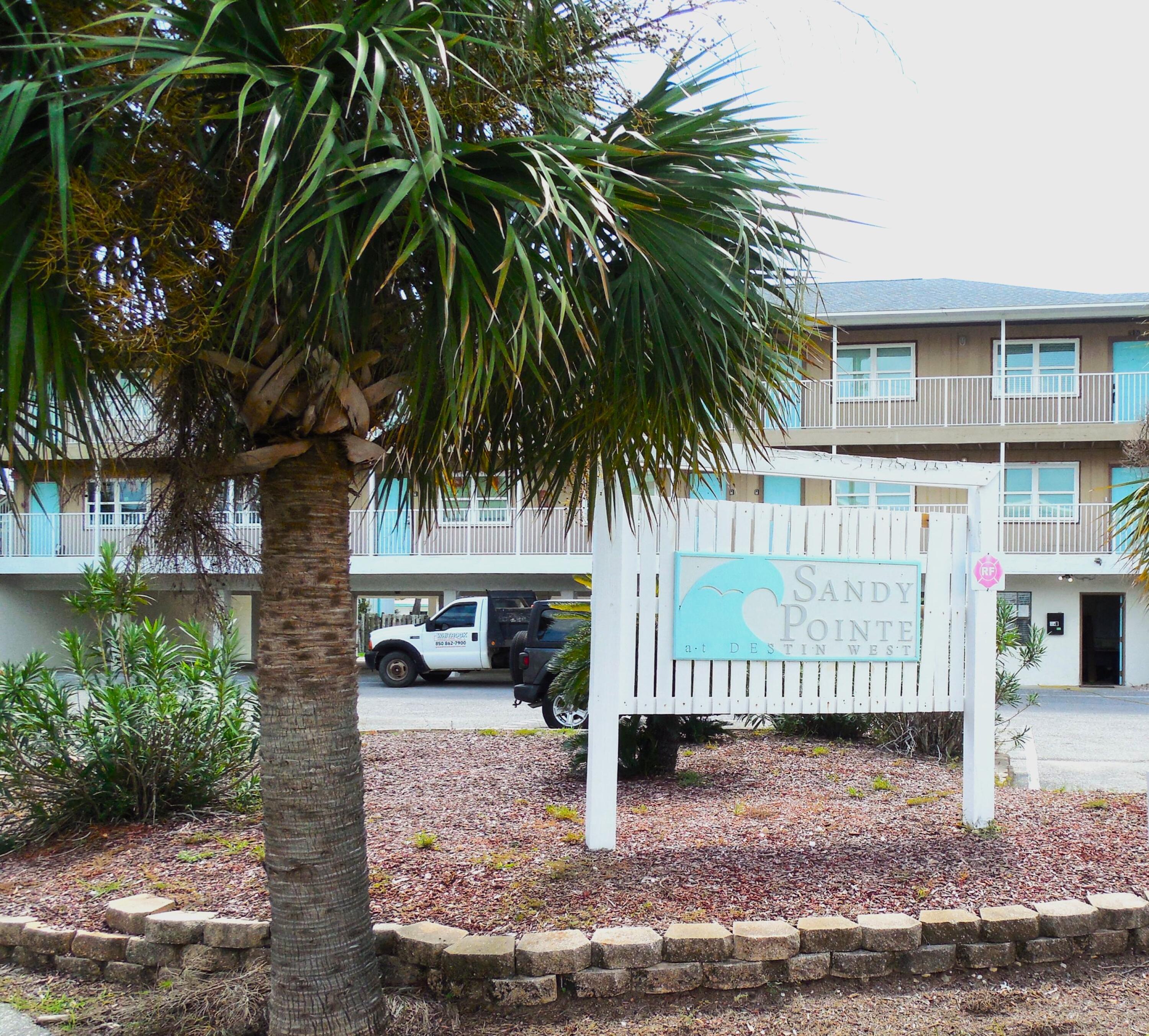 a view of outdoor space with deck and lake view