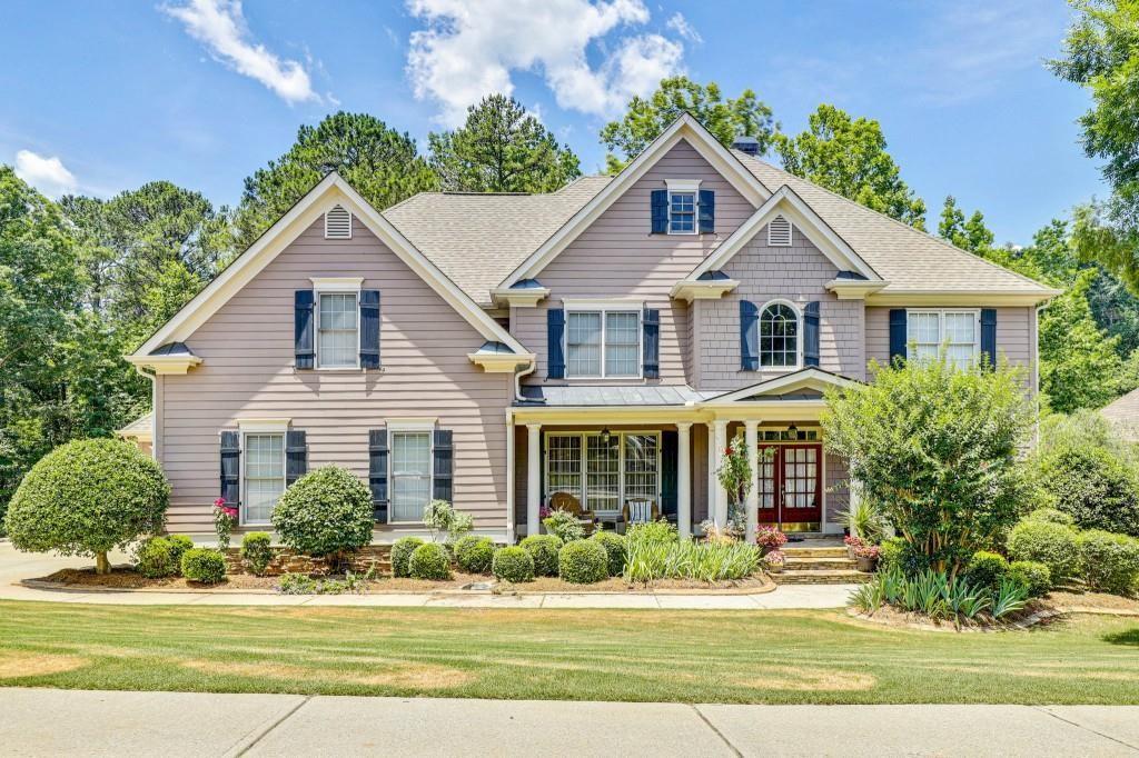 a front view of a house with a yard