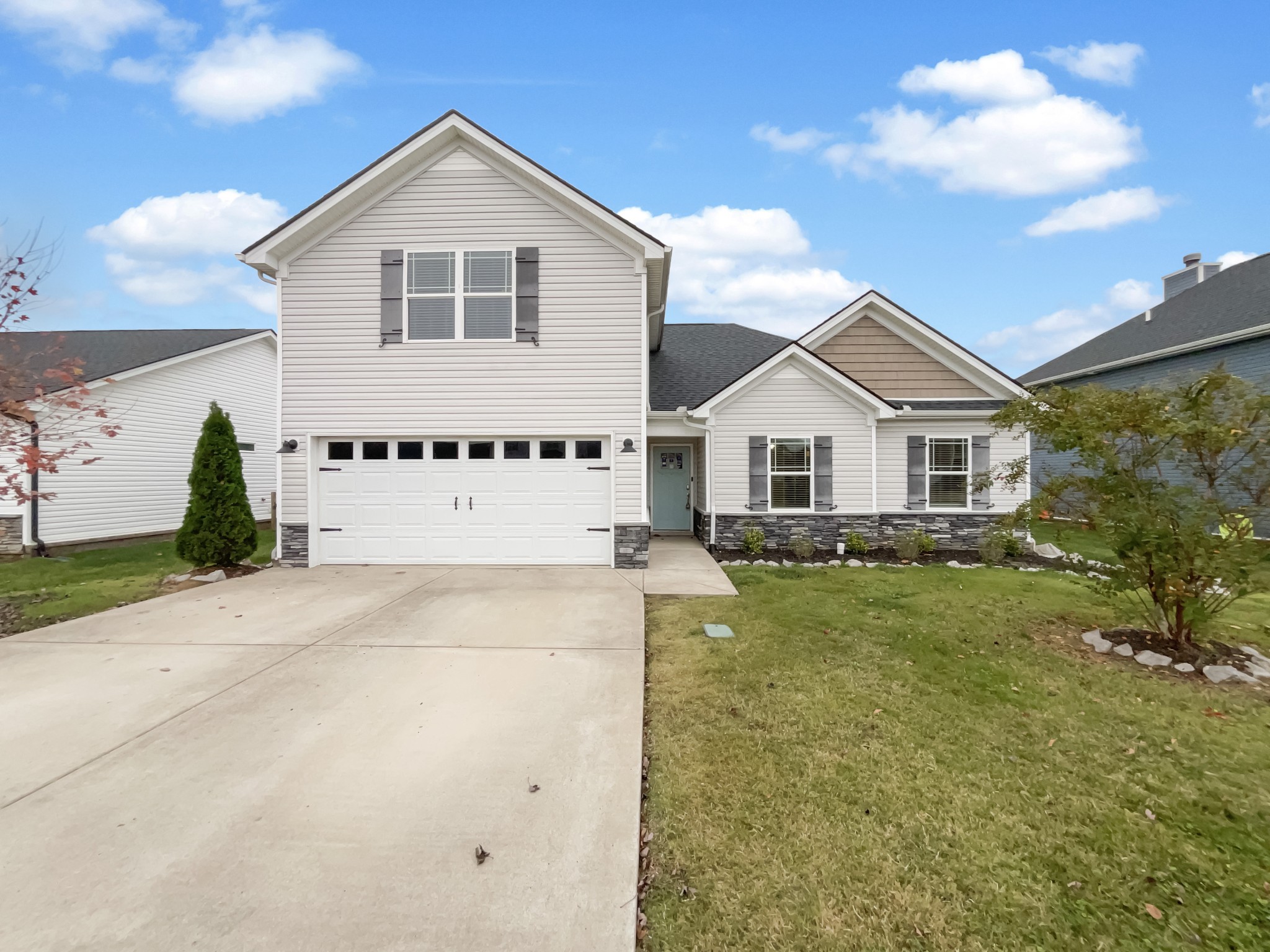 a view of a yard in front of a house with a yard