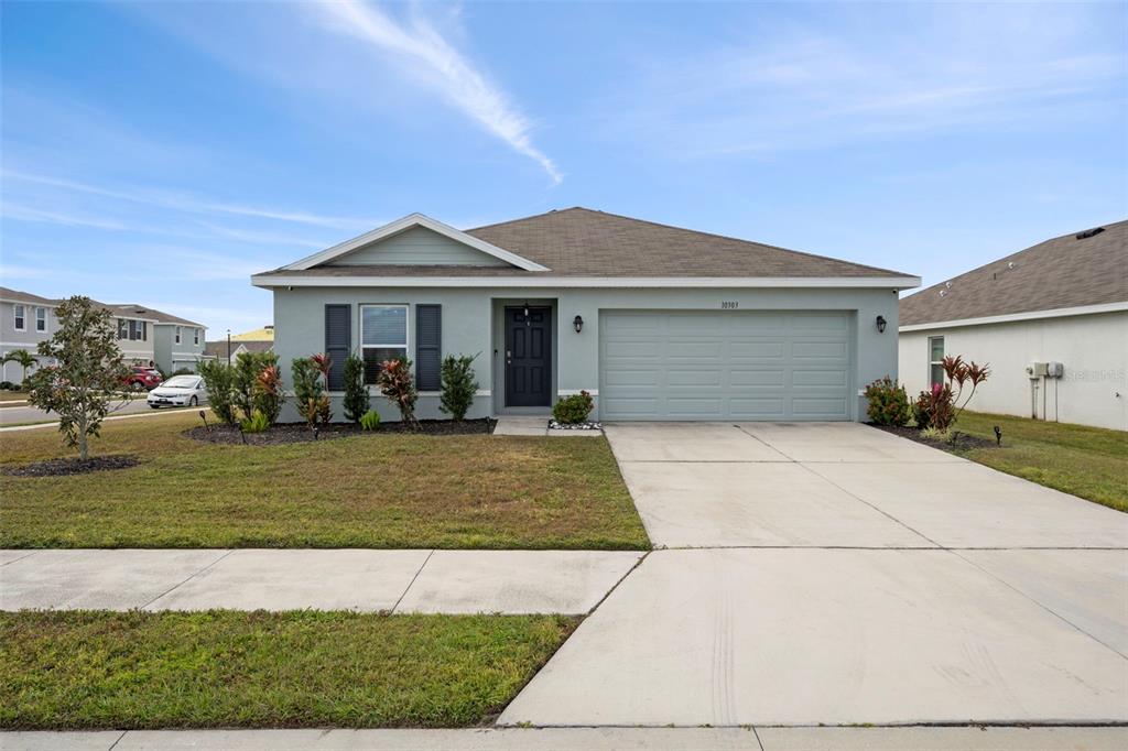 a front view of a house with a yard