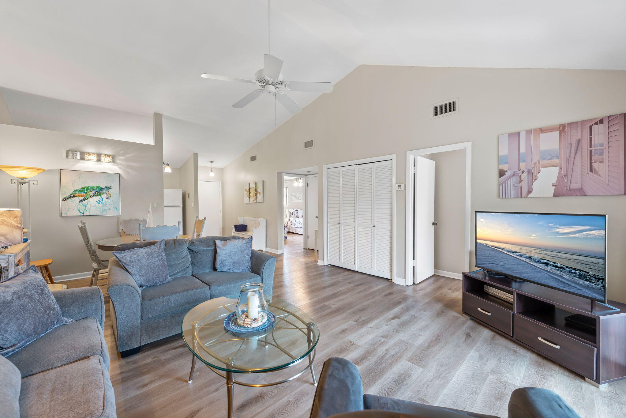 a living room with furniture and a flat screen tv