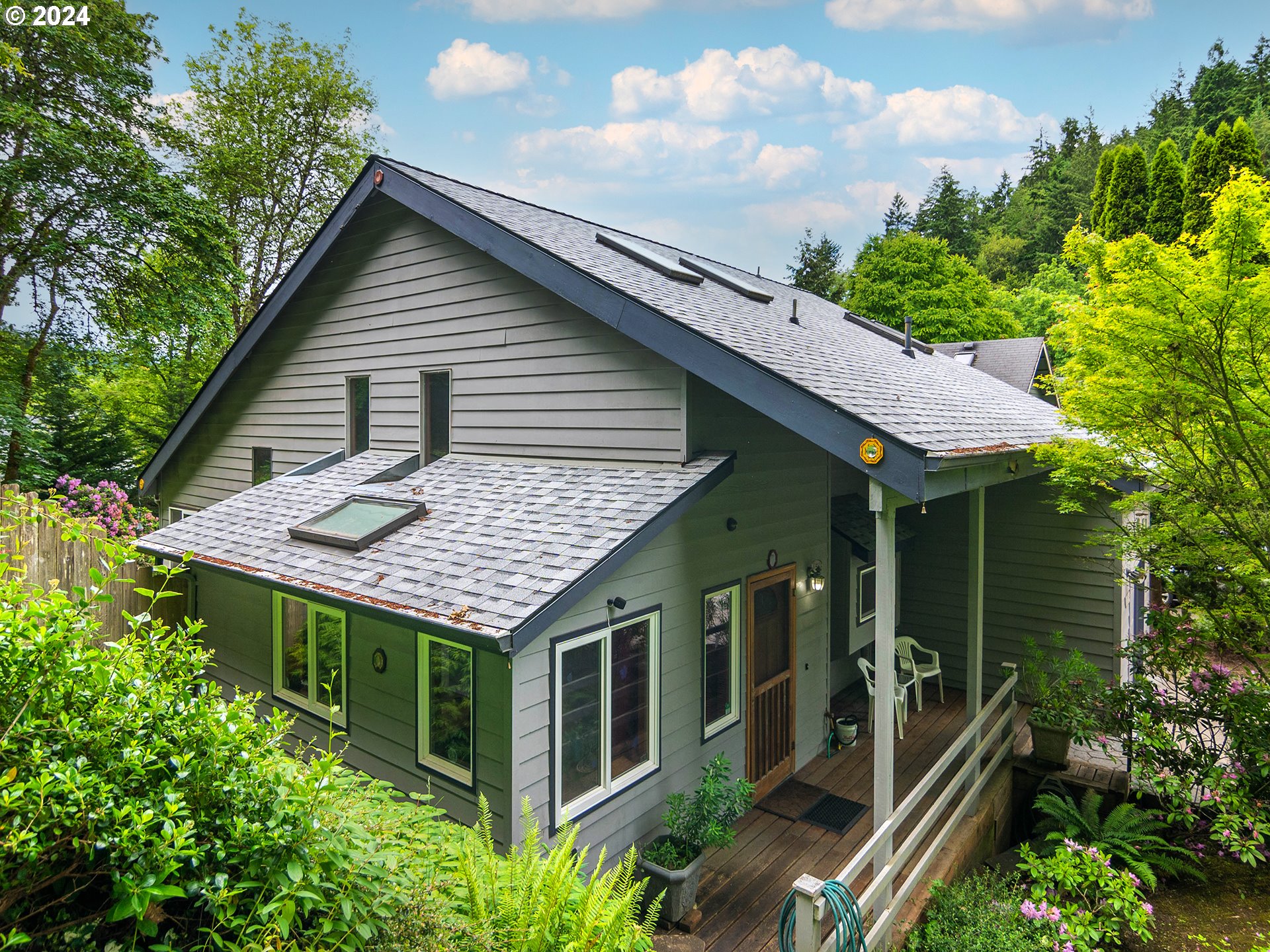 a aerial view of a house with balcony and garage